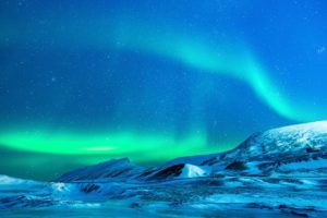 aurora borealis over an icy landscape