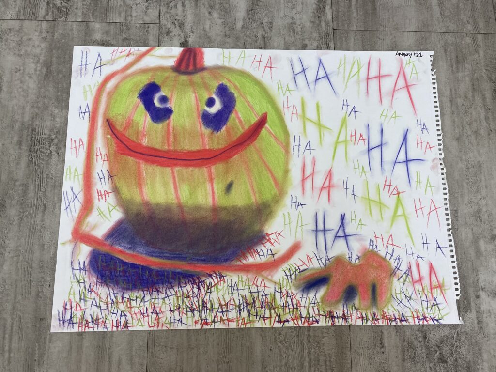 pumpkin with a Joker color scheme