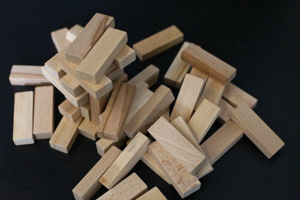 Jenga blocks spread out on a surface