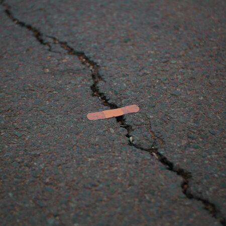 Bandaid over crack in pavement