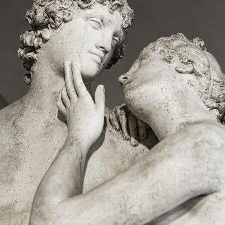 Two statues looking lovingly