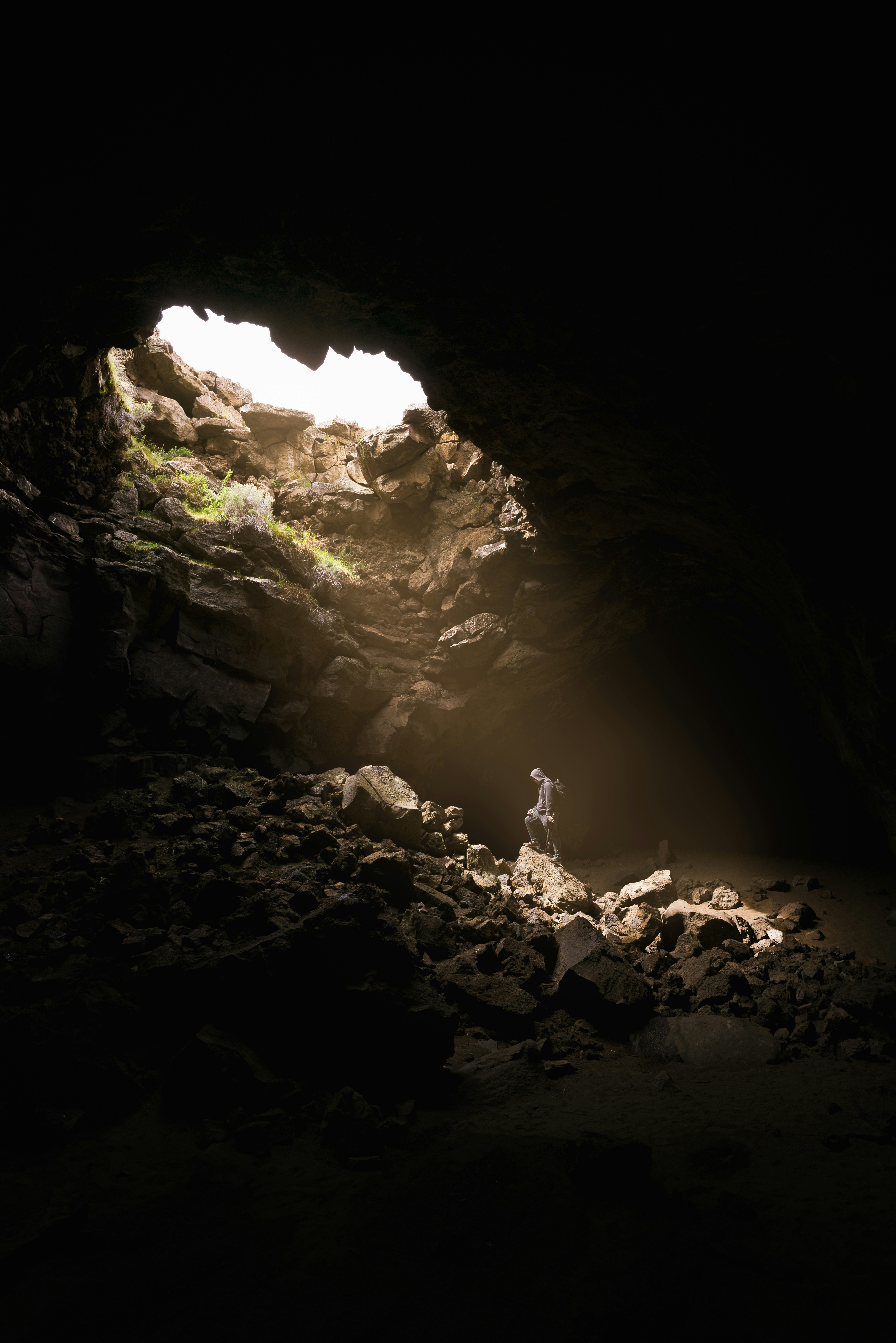 Man standing in dimly lit cave
